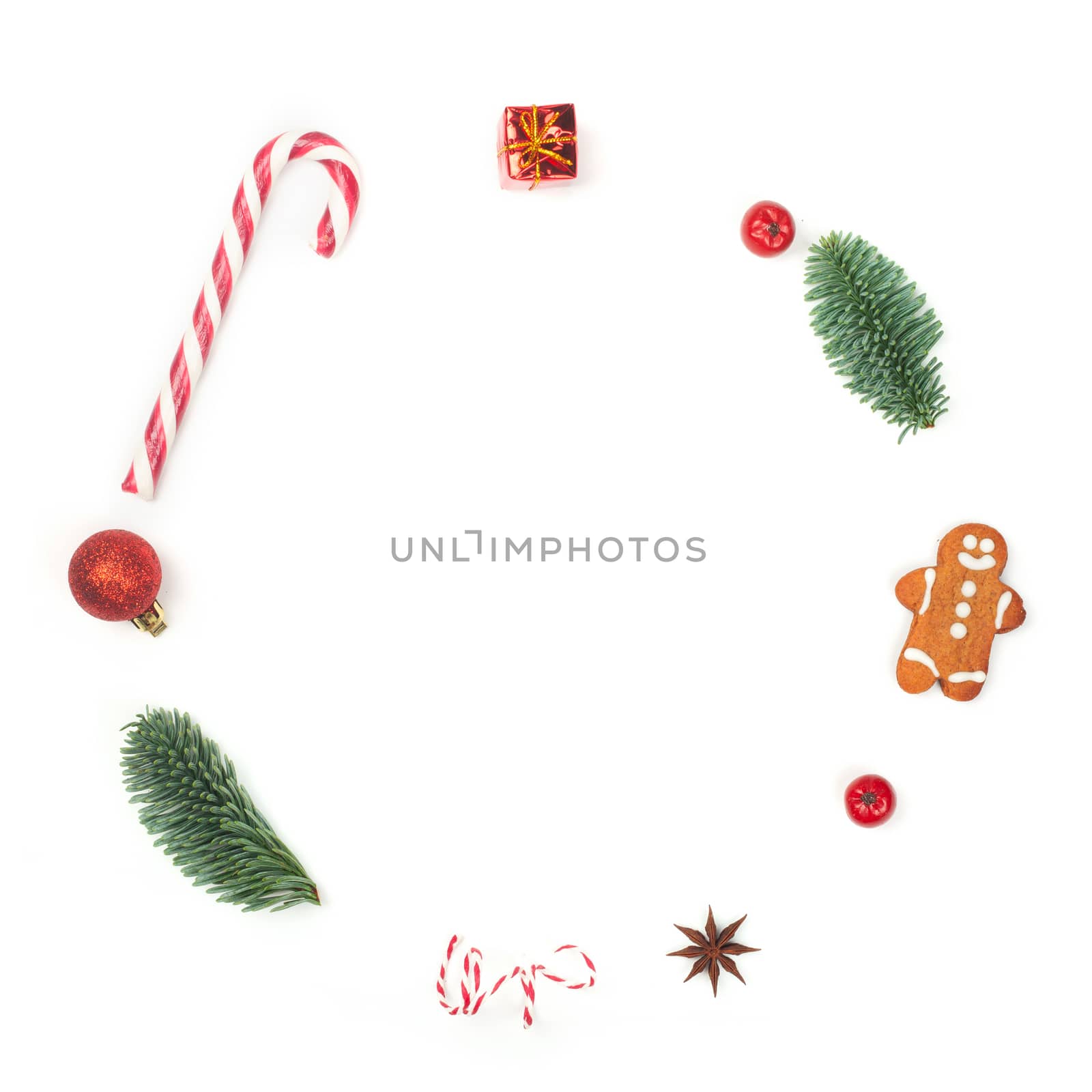 Christmas decorative minimalistic conceptual wreath with noble fir tree twigs and baubles objects design top view isolated on white background. New Year concept.