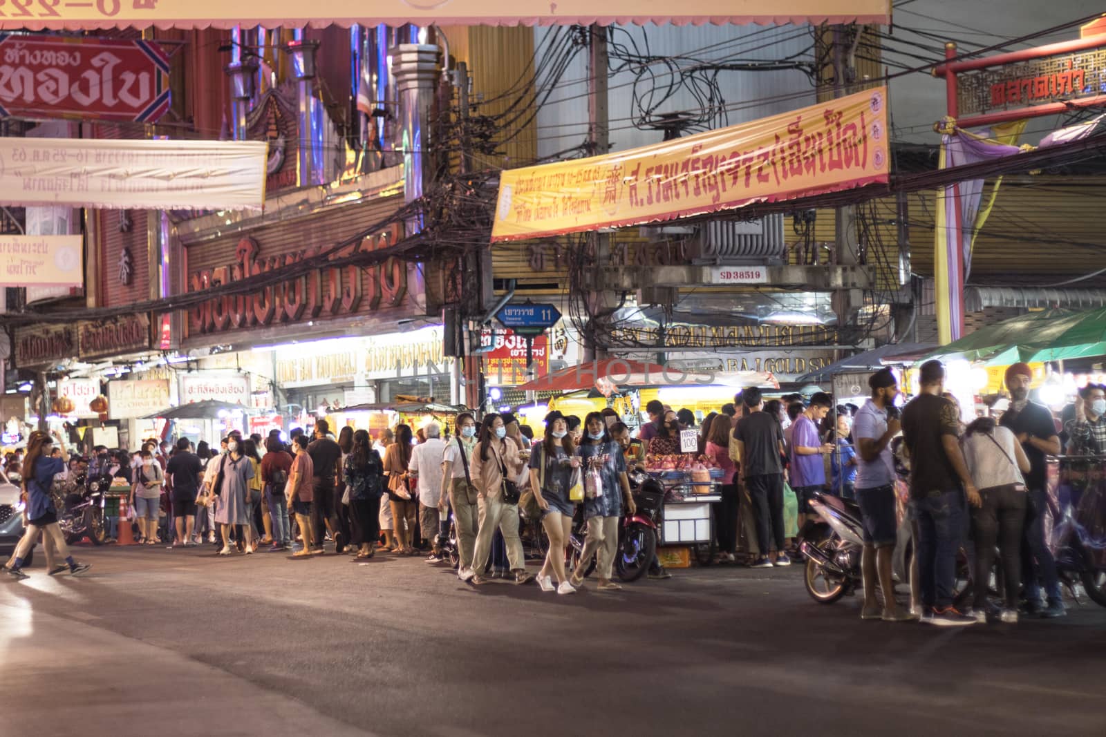 Bangkok Thailand - Oct 24, 2020 :- a lot of people, walking at Street food of Bangkok Some street vendors operate in groups the same place every night and have a different choice of meal