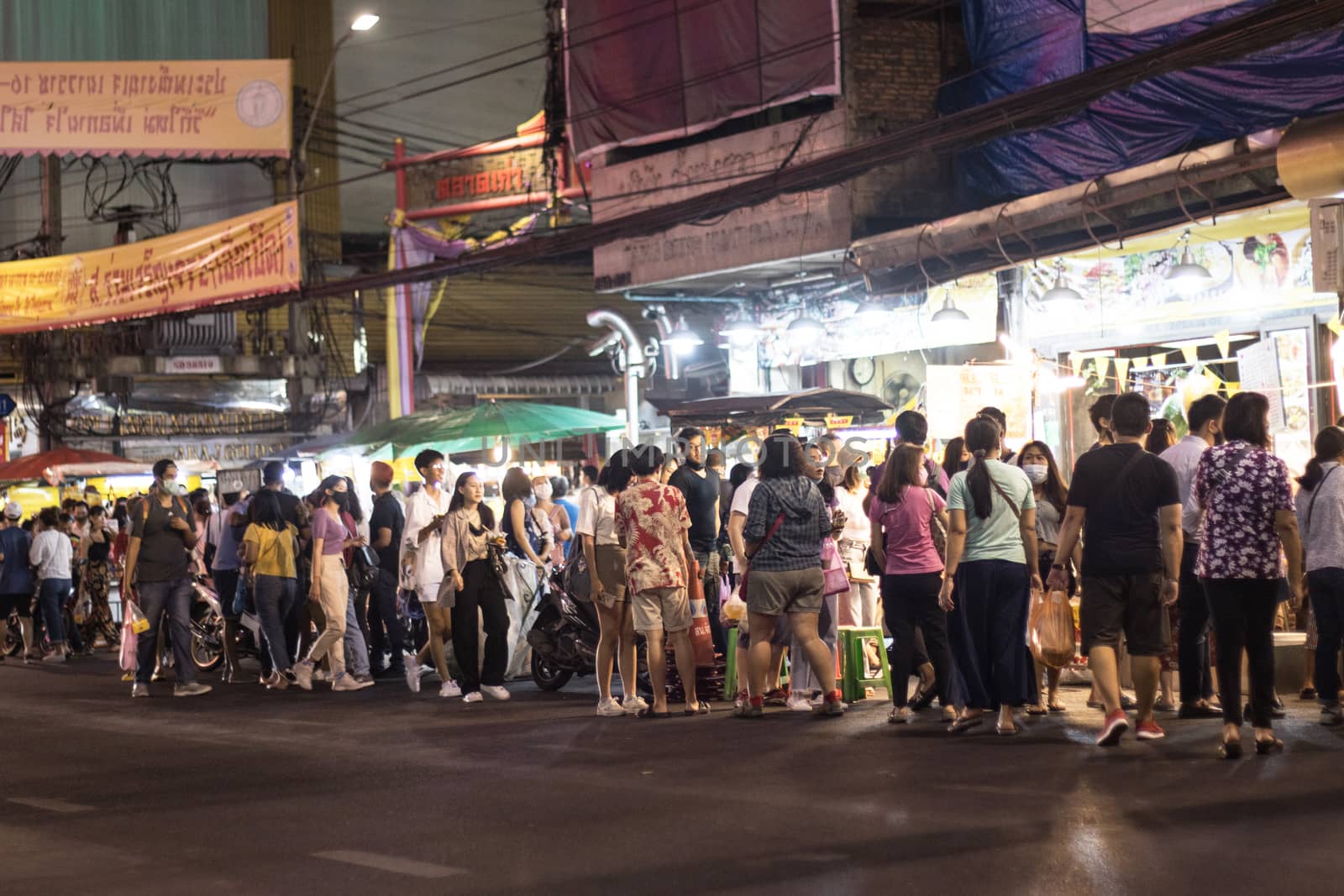 Bangkok Thailand - Oct 24, 2020 :- a lot of people, walking at Street food of Bangkok Some street vendors operate in groups the same place every night and have a different choice of meal
