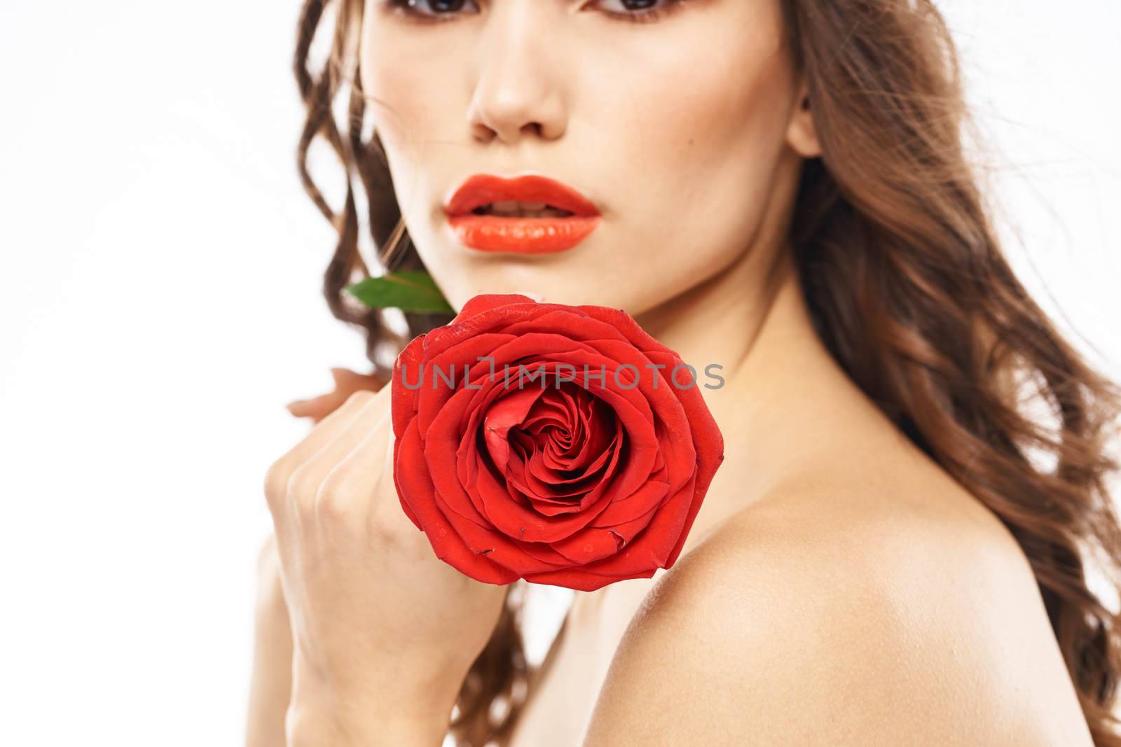 Woman with naked shoulders and red rose evening makeup light background by SHOTPRIME