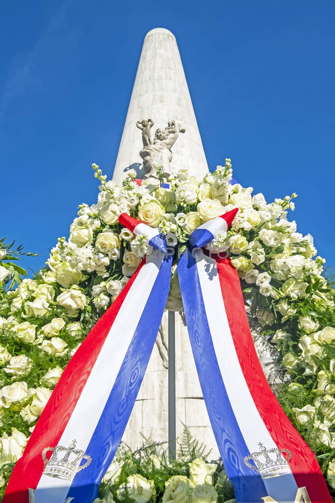 Amsterdam, Netherlands - May 6, 2020: Wreath from King Alexander and Queen Maxima at the Monument on the Dam in Amsterdam Netherlands on occasion of remembrance of the worldwar II