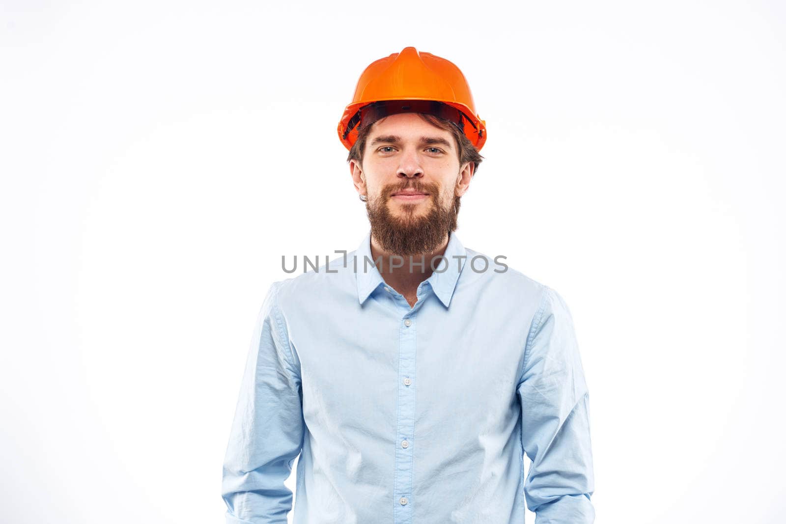 Man in working uniform orange hard hat lifestyle official. High quality photo