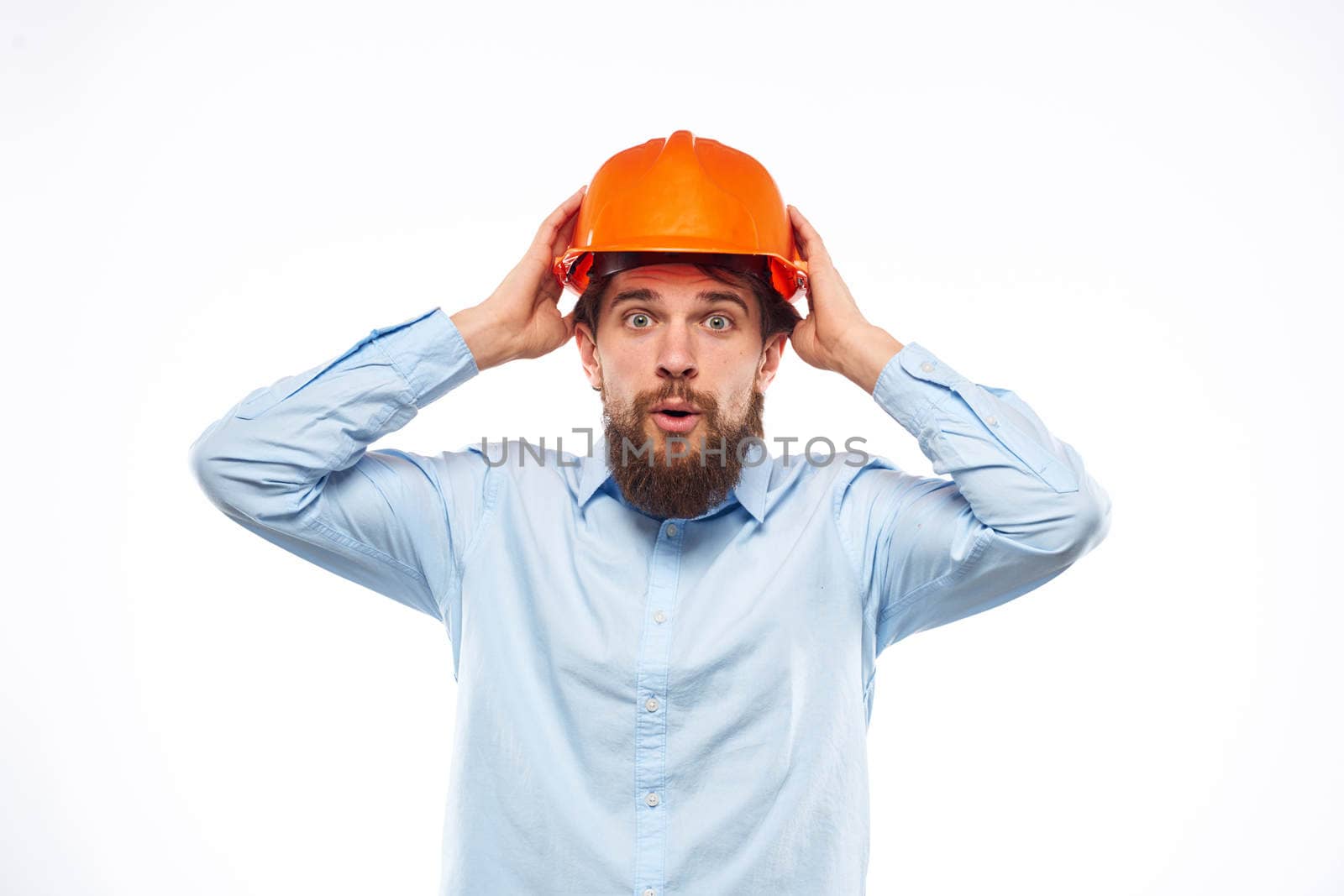 Man in working uniform orange hard hat lifestyle official. High quality photo