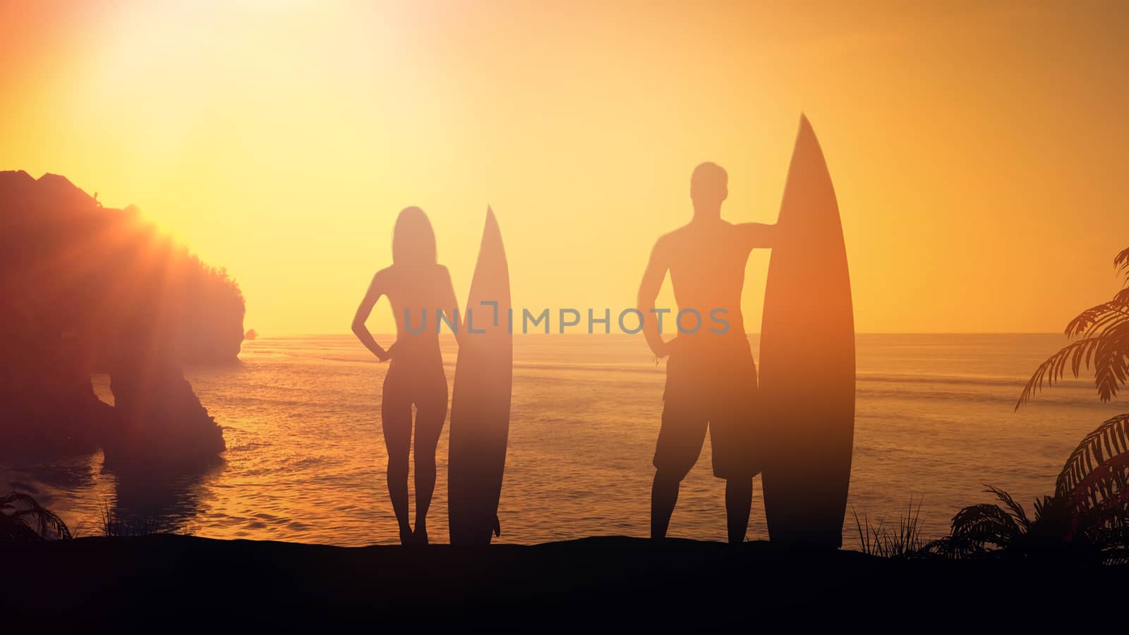 Silhouettes of surfers on the background of ocean sunset.