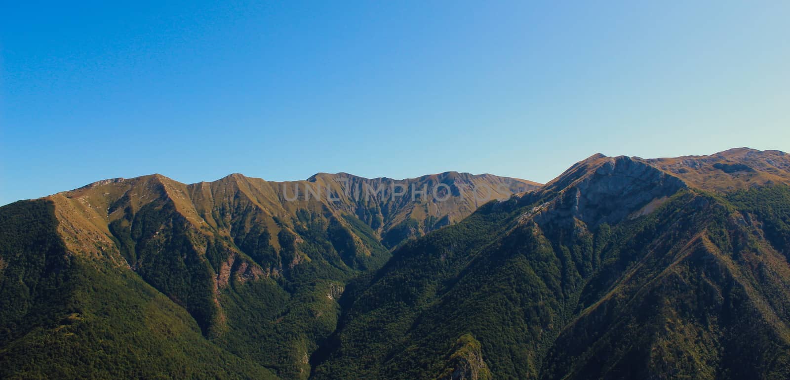 Above the old Bosnian village of Lukomir are beautiful mountains with no vegetation mountain peaks. by mahirrov