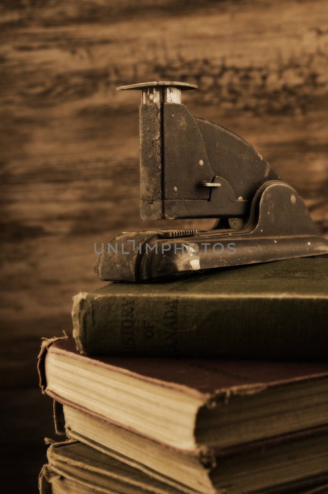 A stack of old books with a vintage feel to the image.