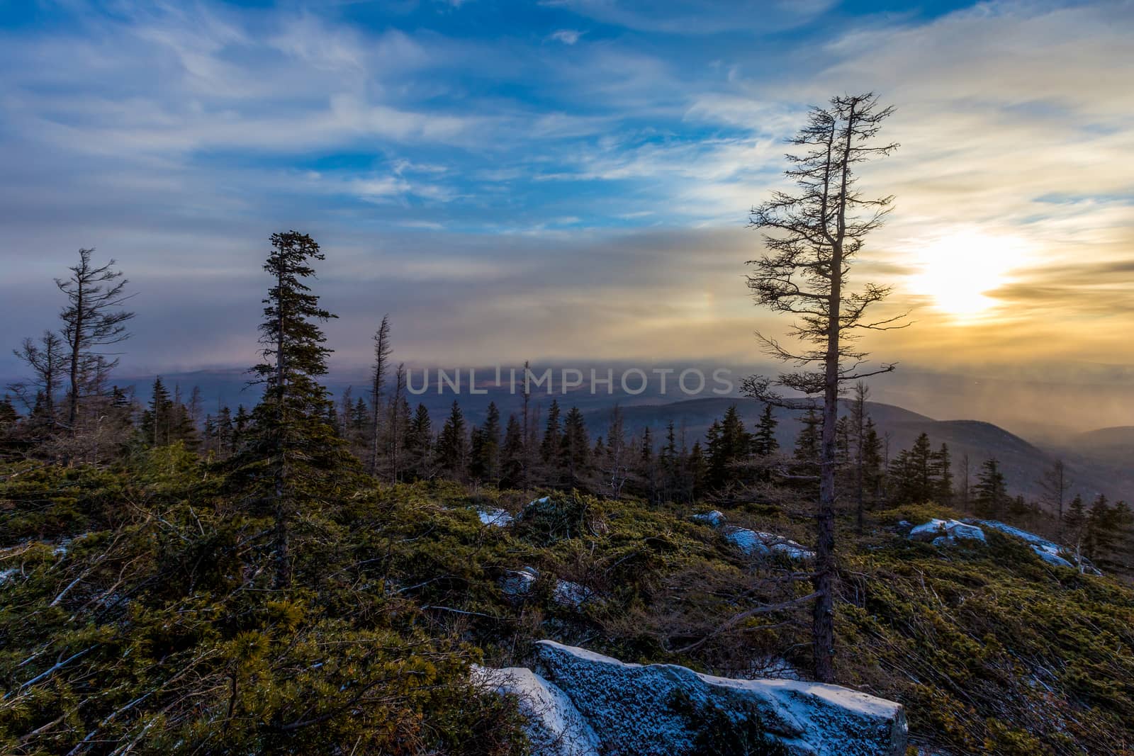 Sunset on the Tukuringra ridge. Beautiful winter sunset on the top of the mountain.