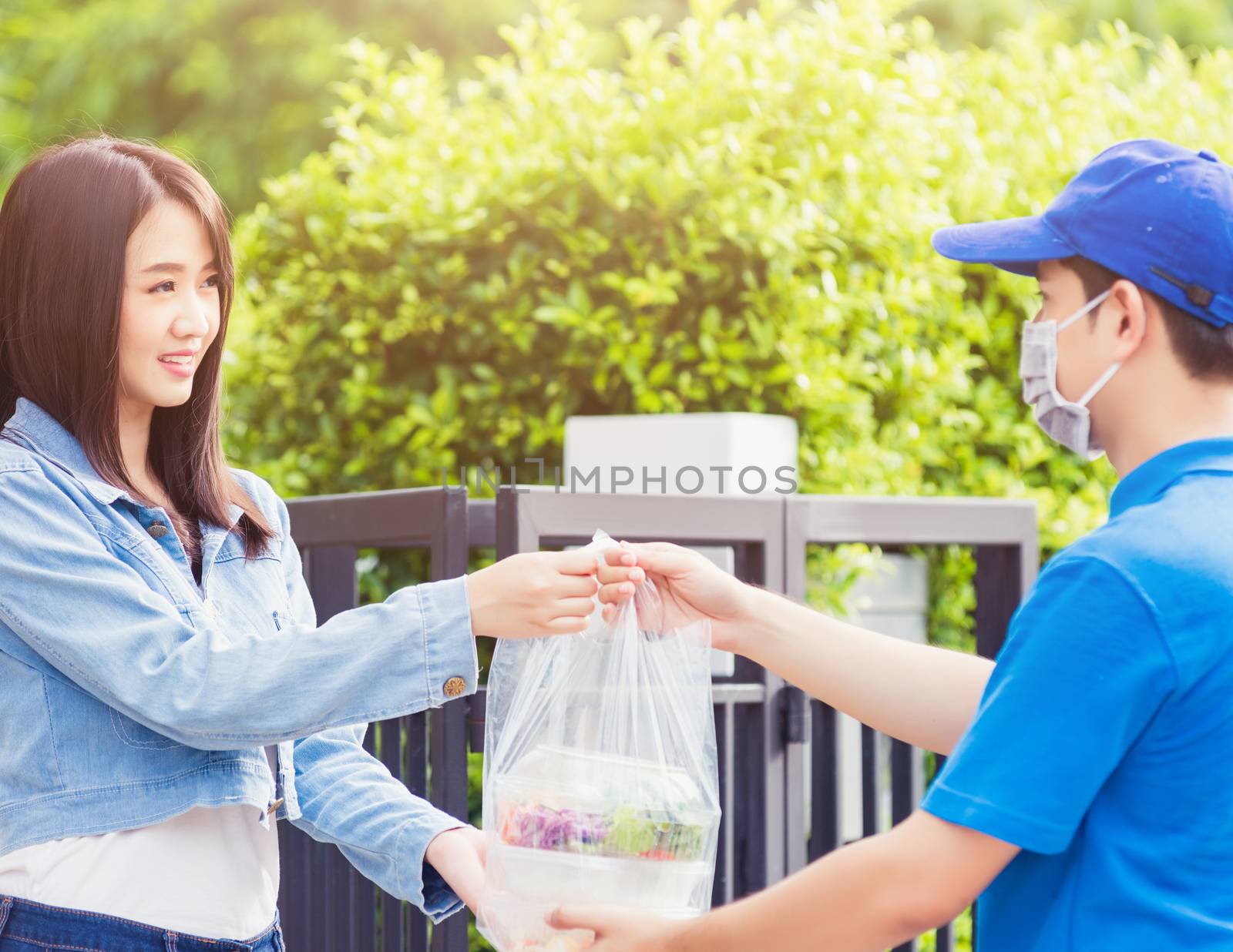 Delivery man making grocery giving rice food boxes plastic bags  by Sorapop