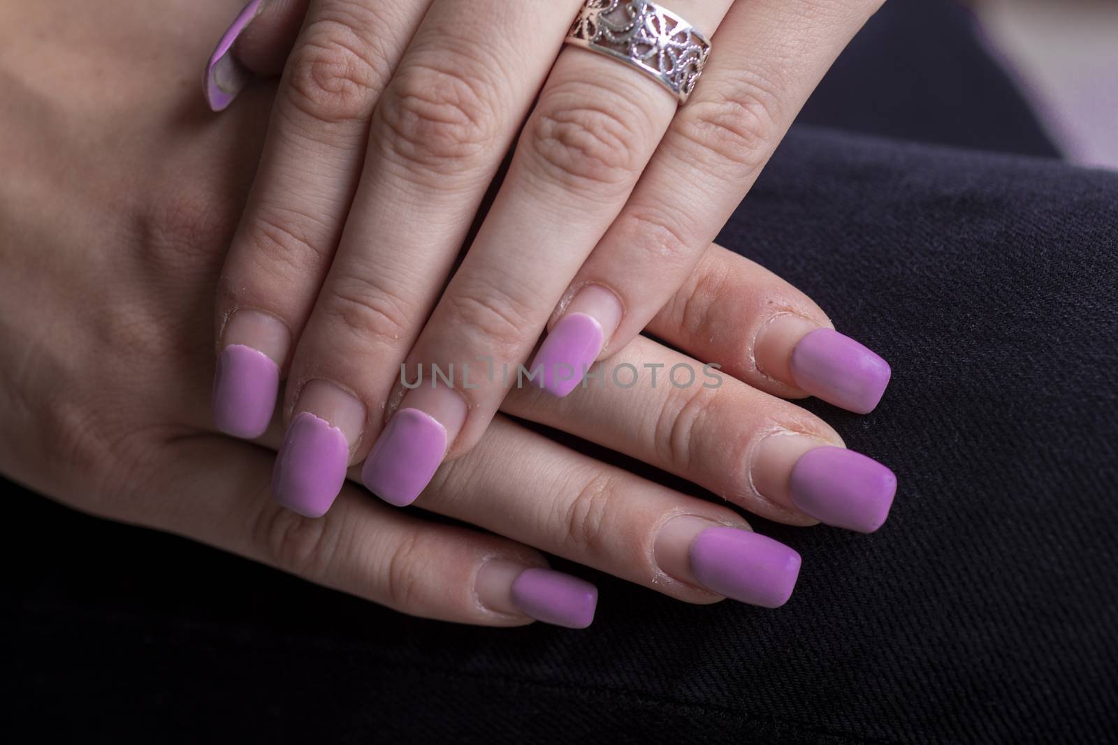 Overgrown gel polish nails manicure. Female hands with overgrown by adamr