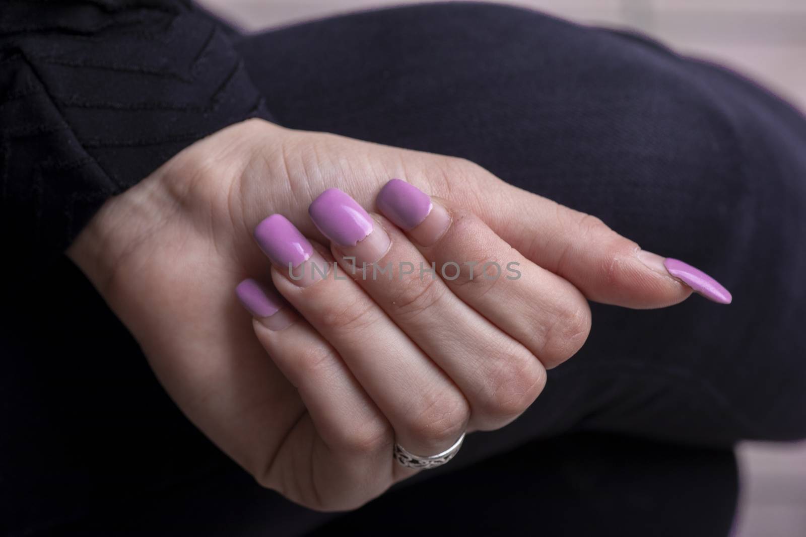 Overgrown gel polish nails manicure. Female hands with overgrown by adamr