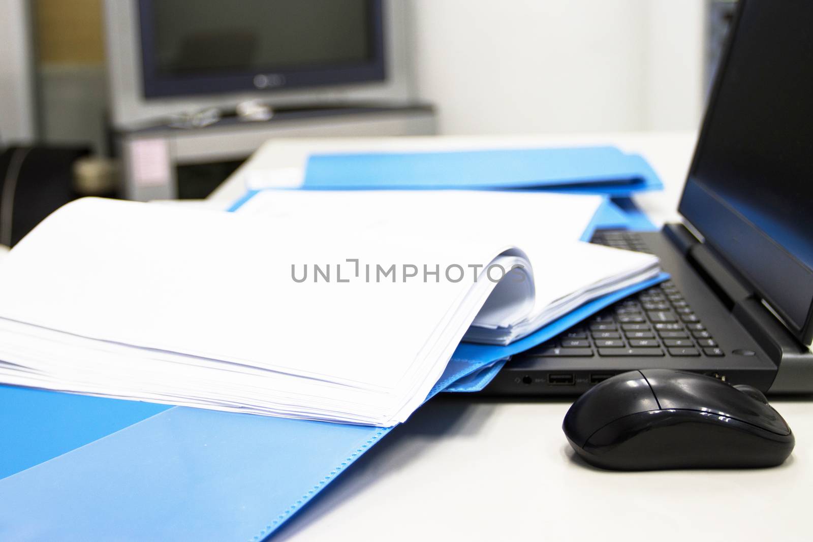 Blue Document folder with Notebook on table at office 