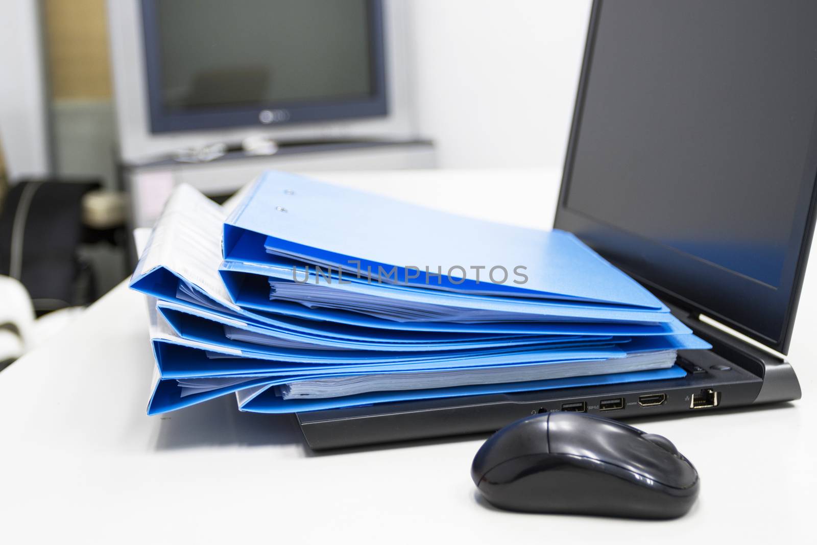 Blue Document folder with Notebook on table at office 