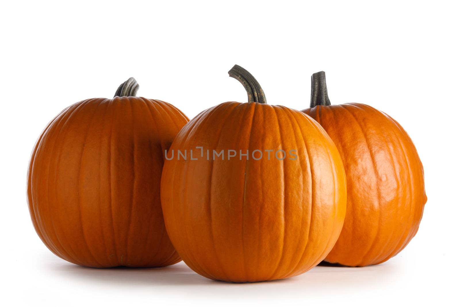Orange pumpkins isolated on white by Yellowj