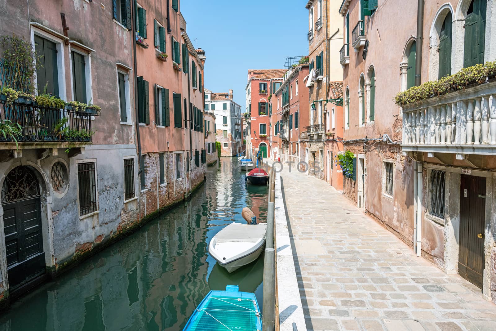 Small channel in the old town of Venice, Italy