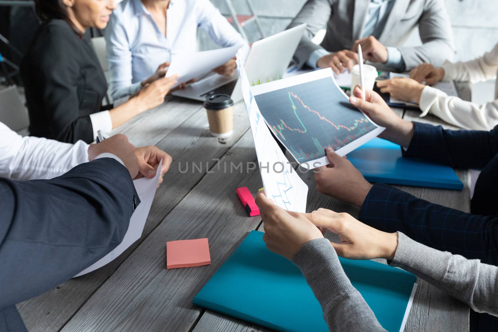 Business corporate management planning team concept, people sitting around office table and working with financial data reports