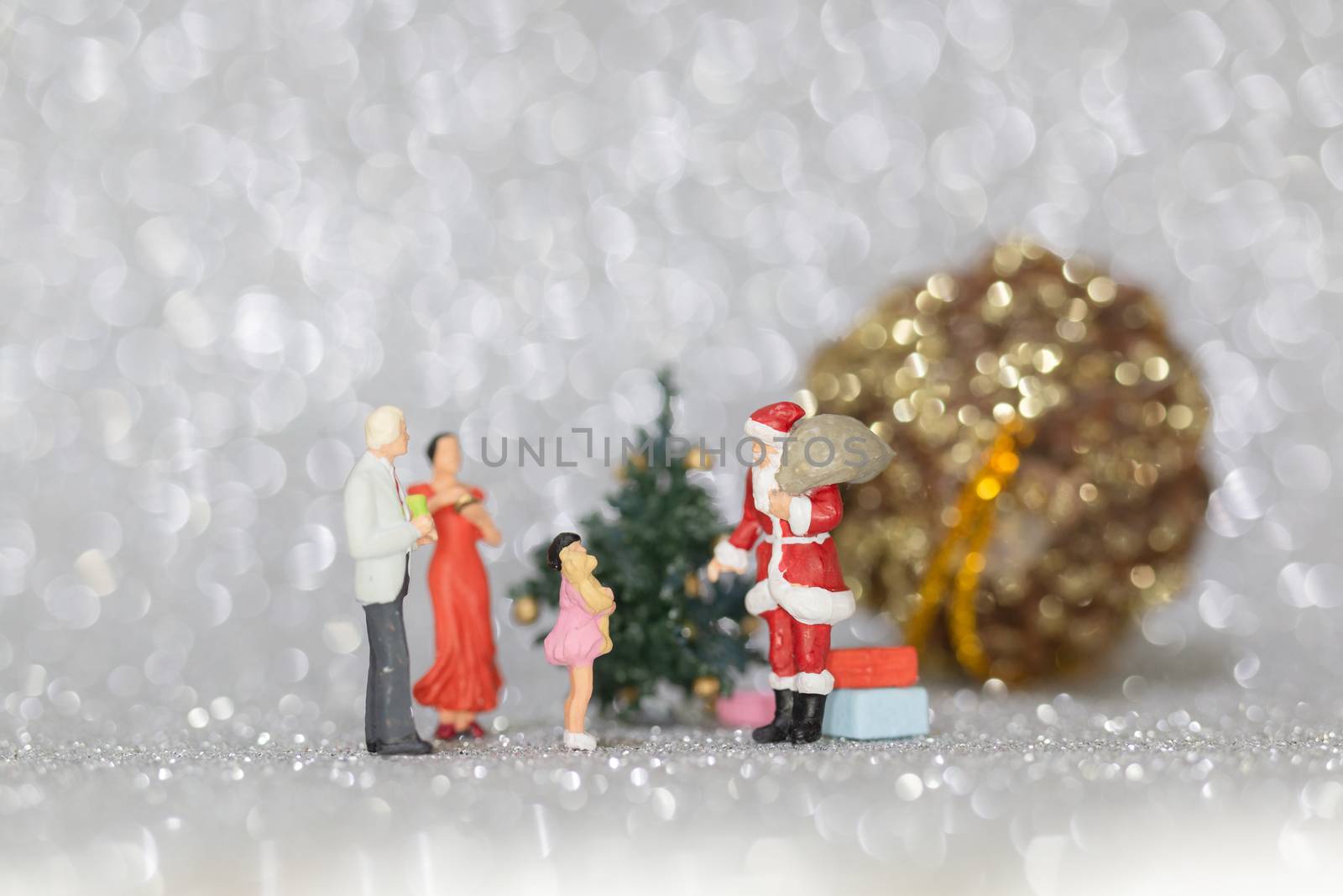 Miniature people, Happy family celebrating A Christmas  , Christmas and Happy New Year concept.