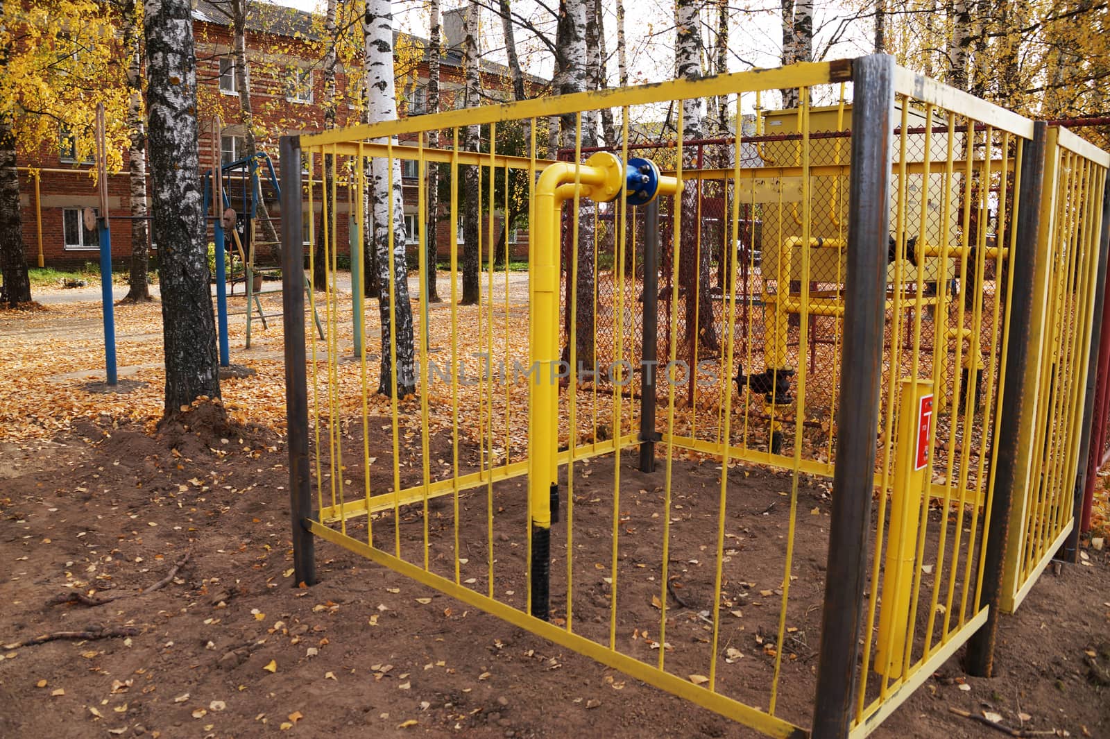 gas distribution unit, enclosed by a metal fence.
