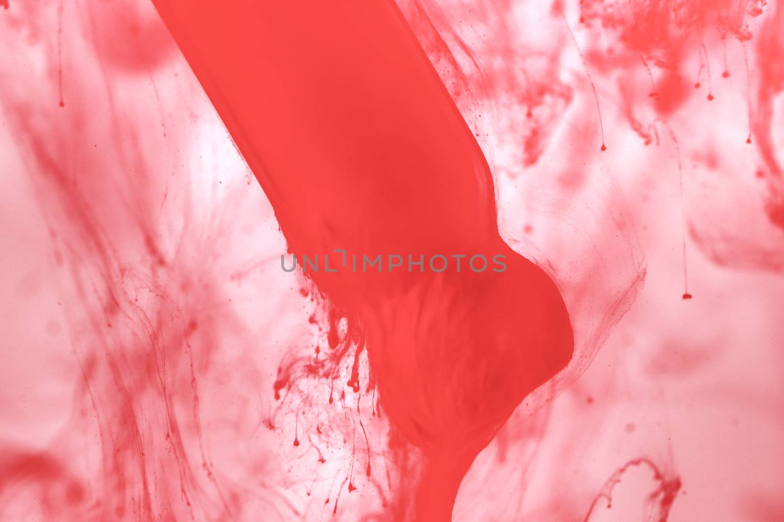 Science and art experiment color dripping into red template bright red background image concept.
