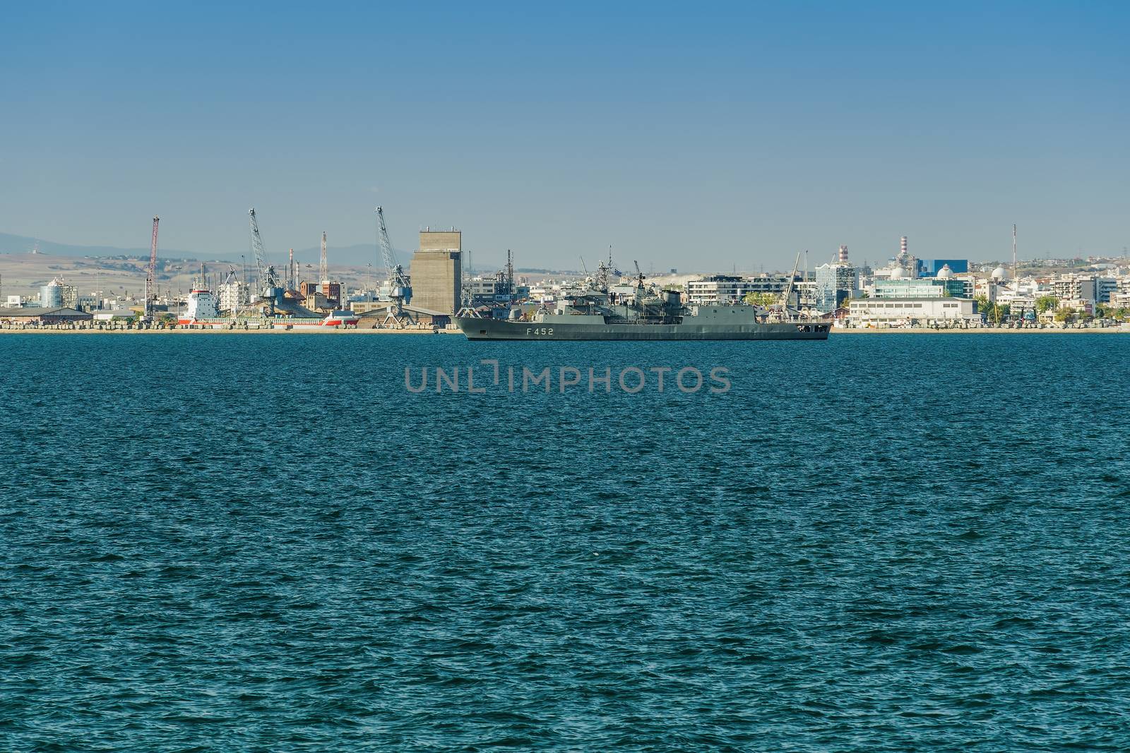 Hydra-class flagship of the Hellenic Navy moored outside the city port, during a national holiday..