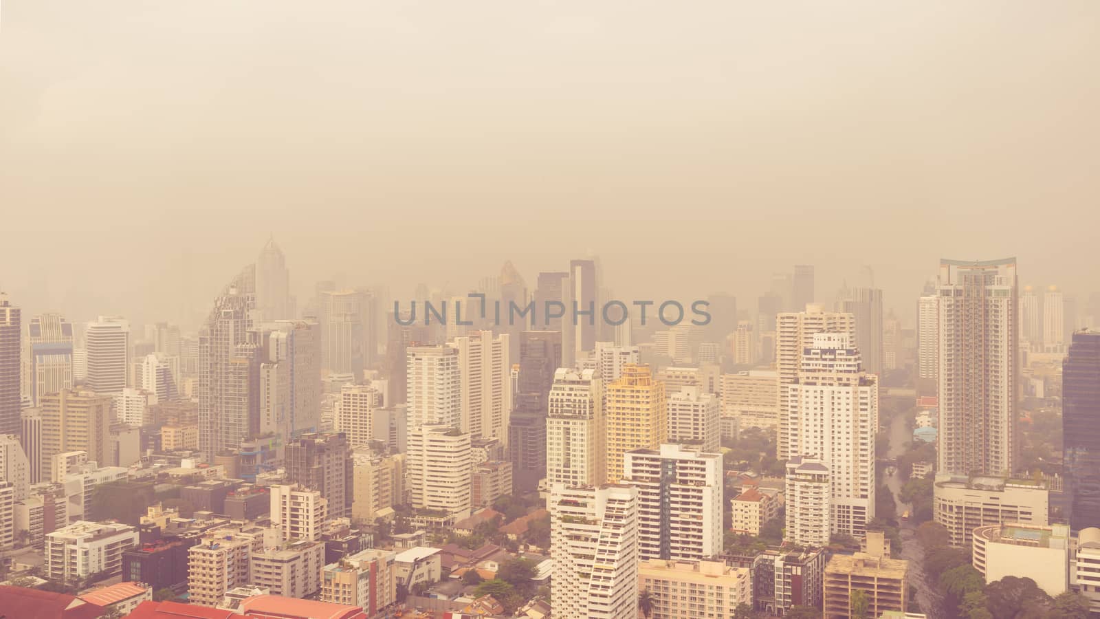 cityscape of high rise buildings in poor weather morning by happycreator