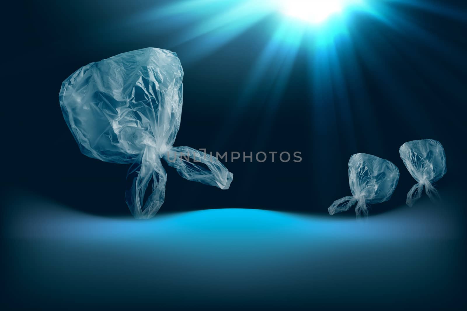single-use transparent plastic bag in form of jellyfish floating in sea or ocean by happycreator