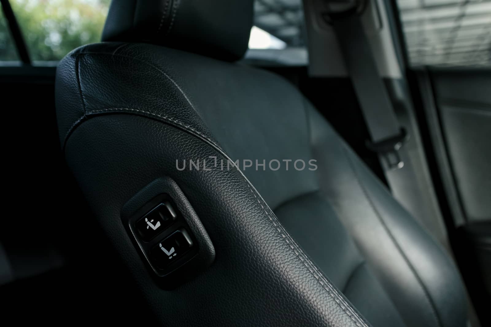 push switch for adjusting the front-passenger seat from the driver's seat, seat control buttons in modern car, shallow depth of field
