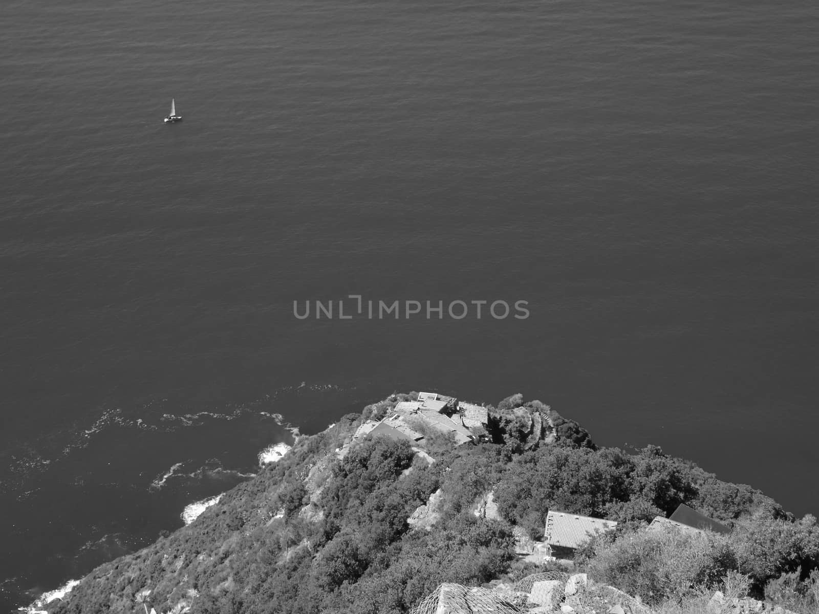 Liguria, Italy - 06/15/2020: Travelling around the ligurian seaside in summer days with beautiful view to the famous places. An amazing caption of the water and the sky reflection with blue sky.