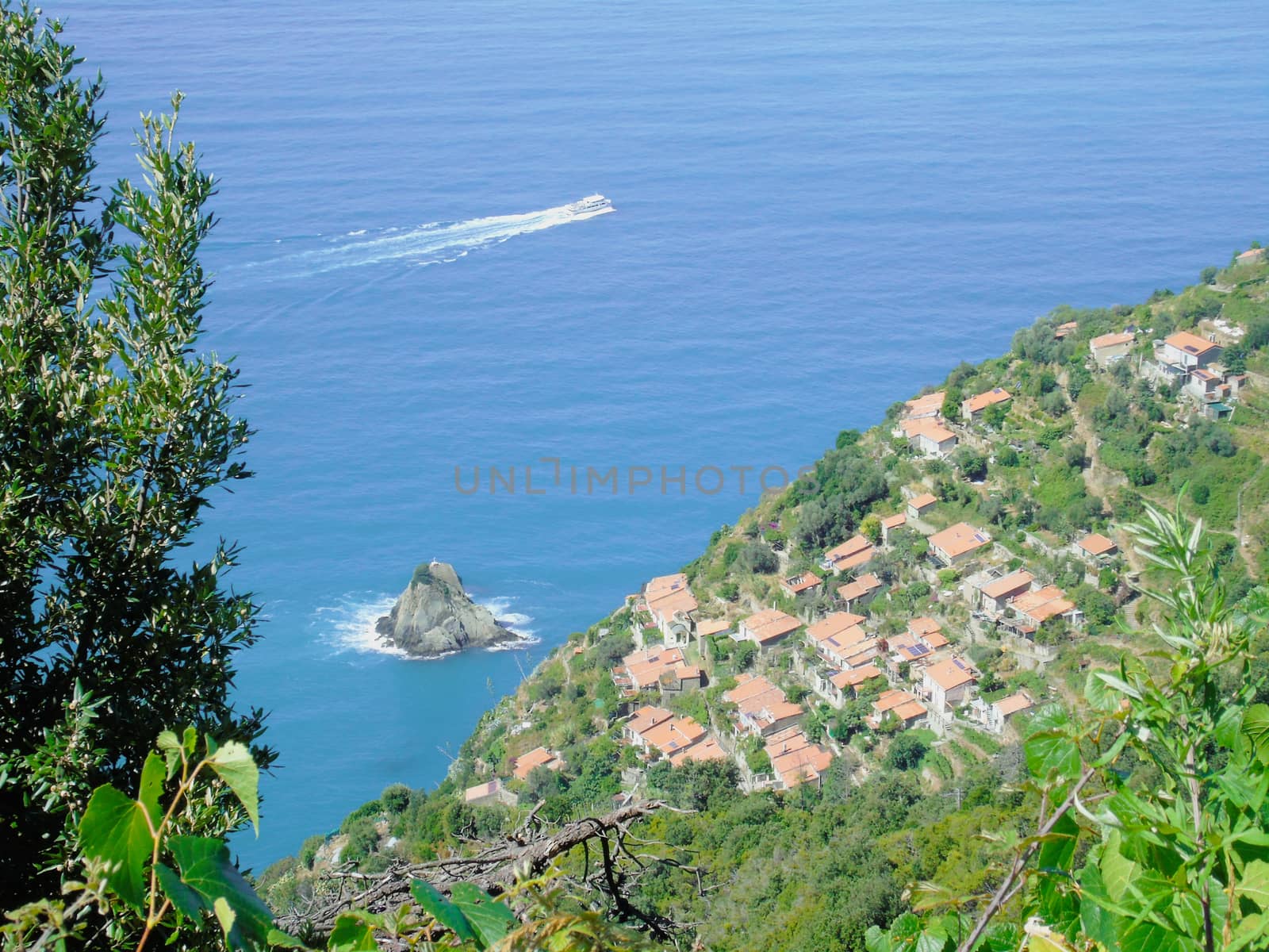 Liguria, Italy - 06/15/2020: Travelling around the ligurian seaside in summer days with beautiful view to the famous places. An amazing caption of the water and the sky reflection with blue sky.