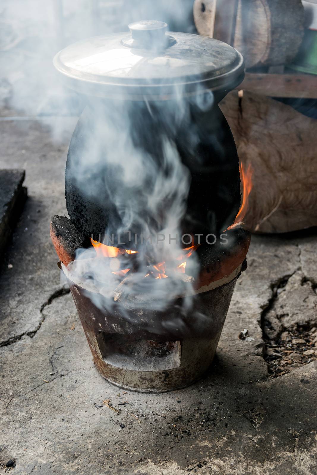 Antique old stove with a pot.