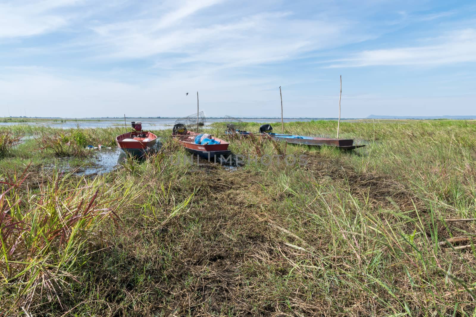 Long-tail boats moored near the river