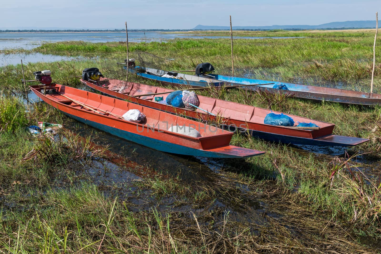 Long-tail boats moored near the river