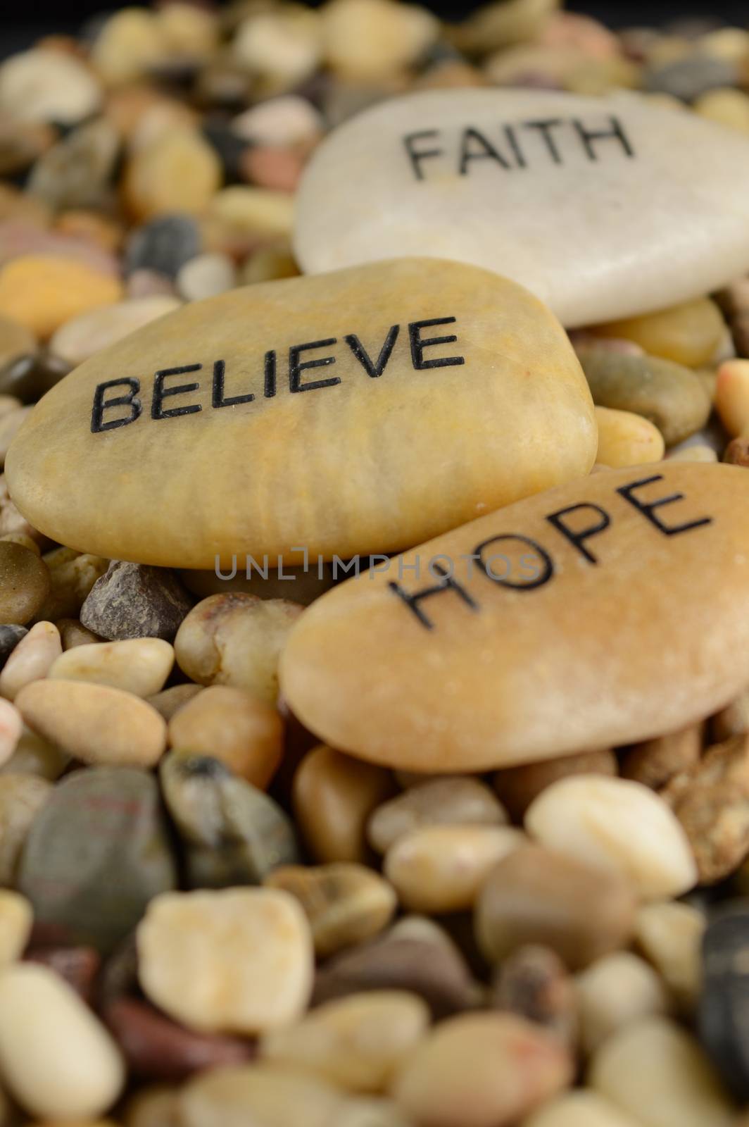 Three stones with words of affirmations hold meaning for various purposes.