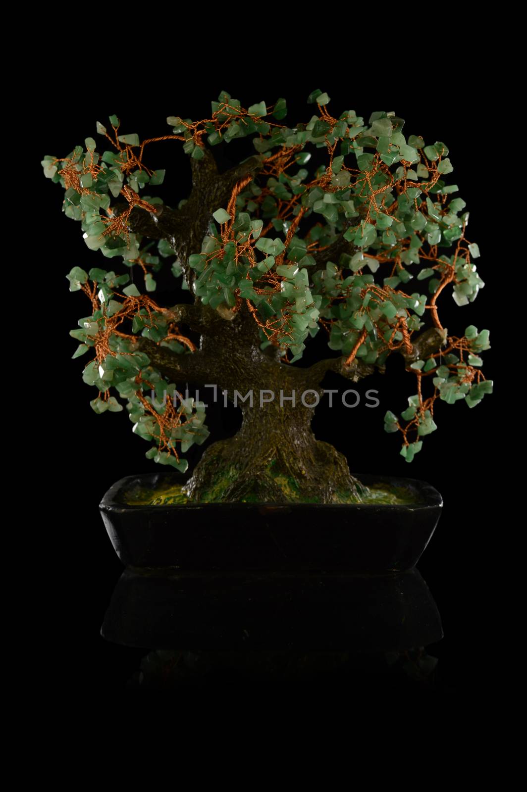 An isolated over black background image of a copper wire money tree to bring good luck and prosperisty.