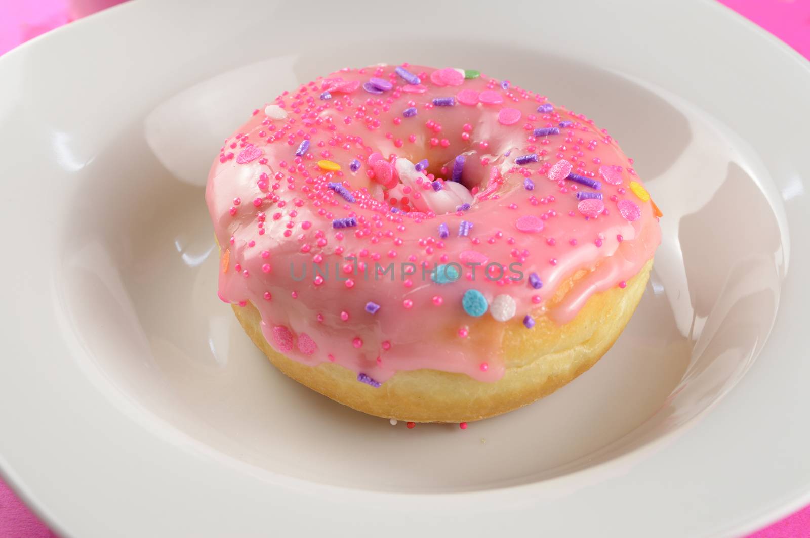 A sweet freshly baked donut invites you to take the first bite.