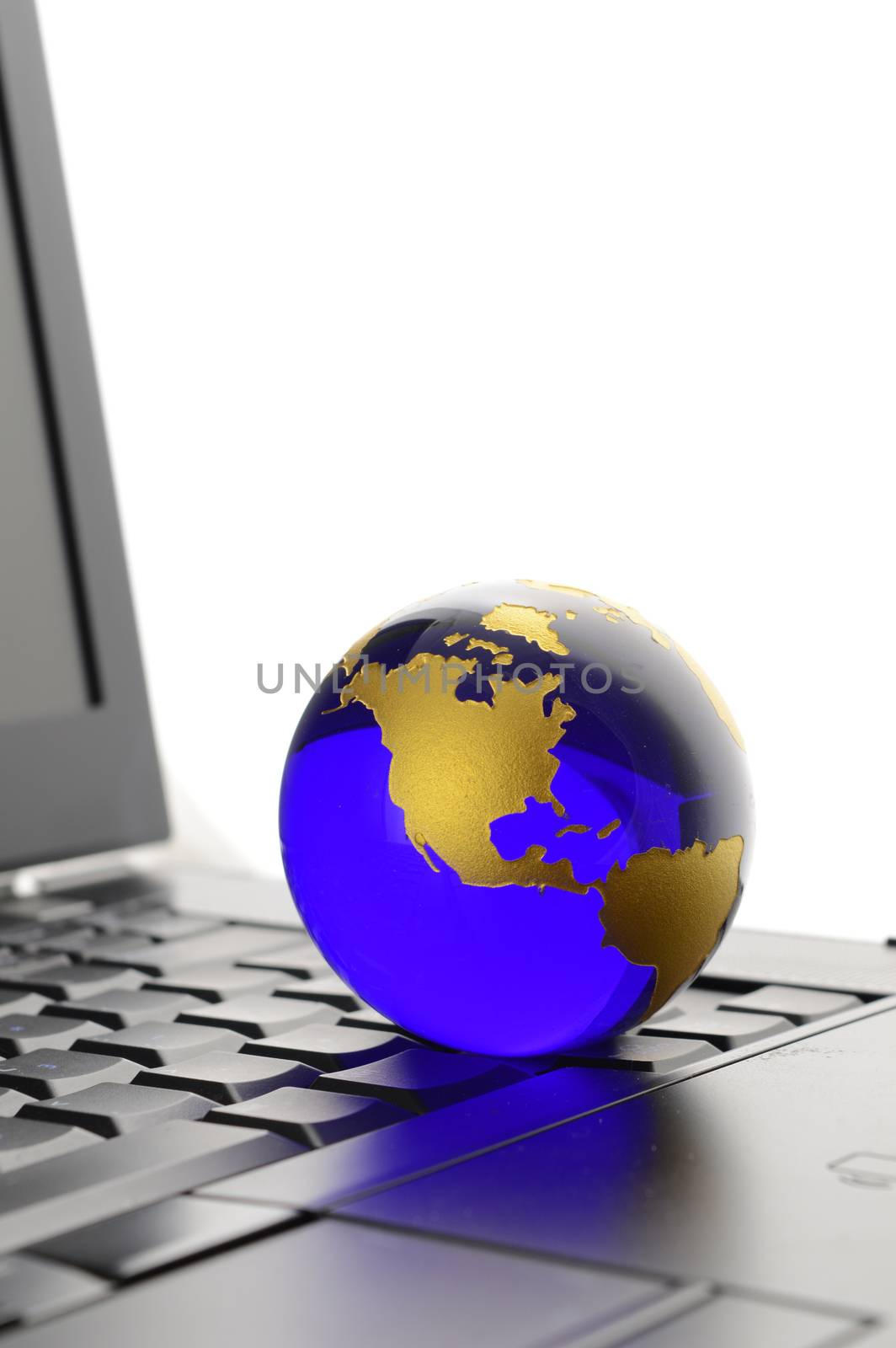 A conceptual image of a globe of Earth with a laptop for networking ideas.