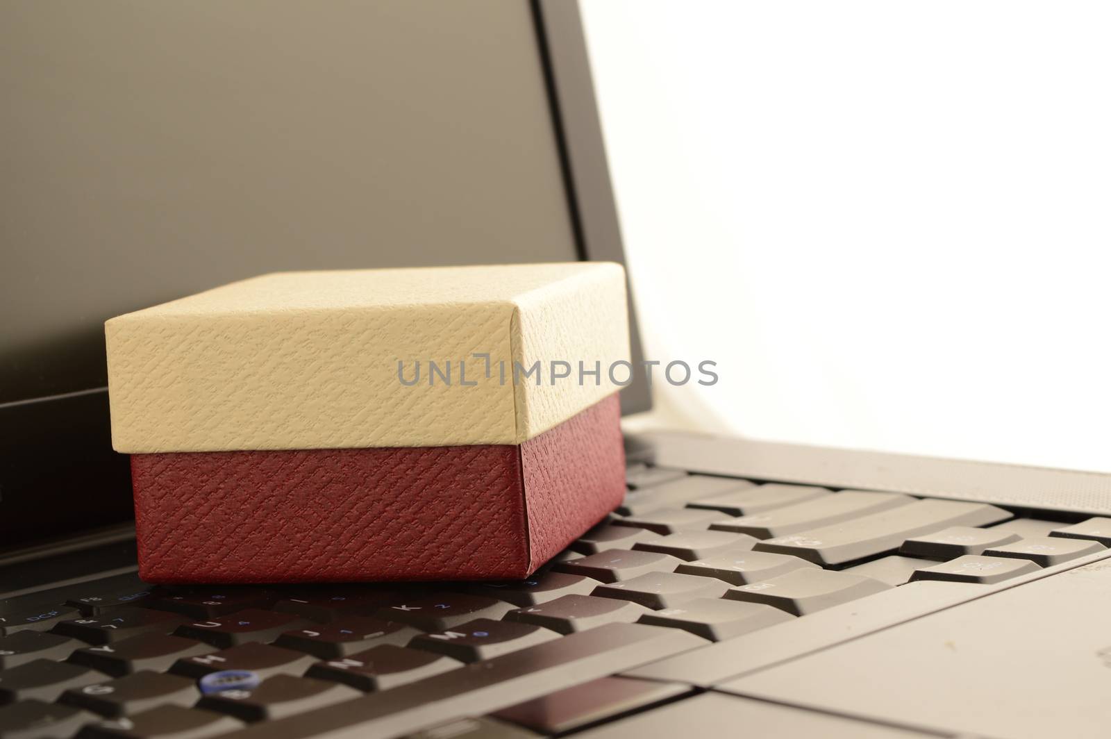 A gift box and laptop for online shopping.