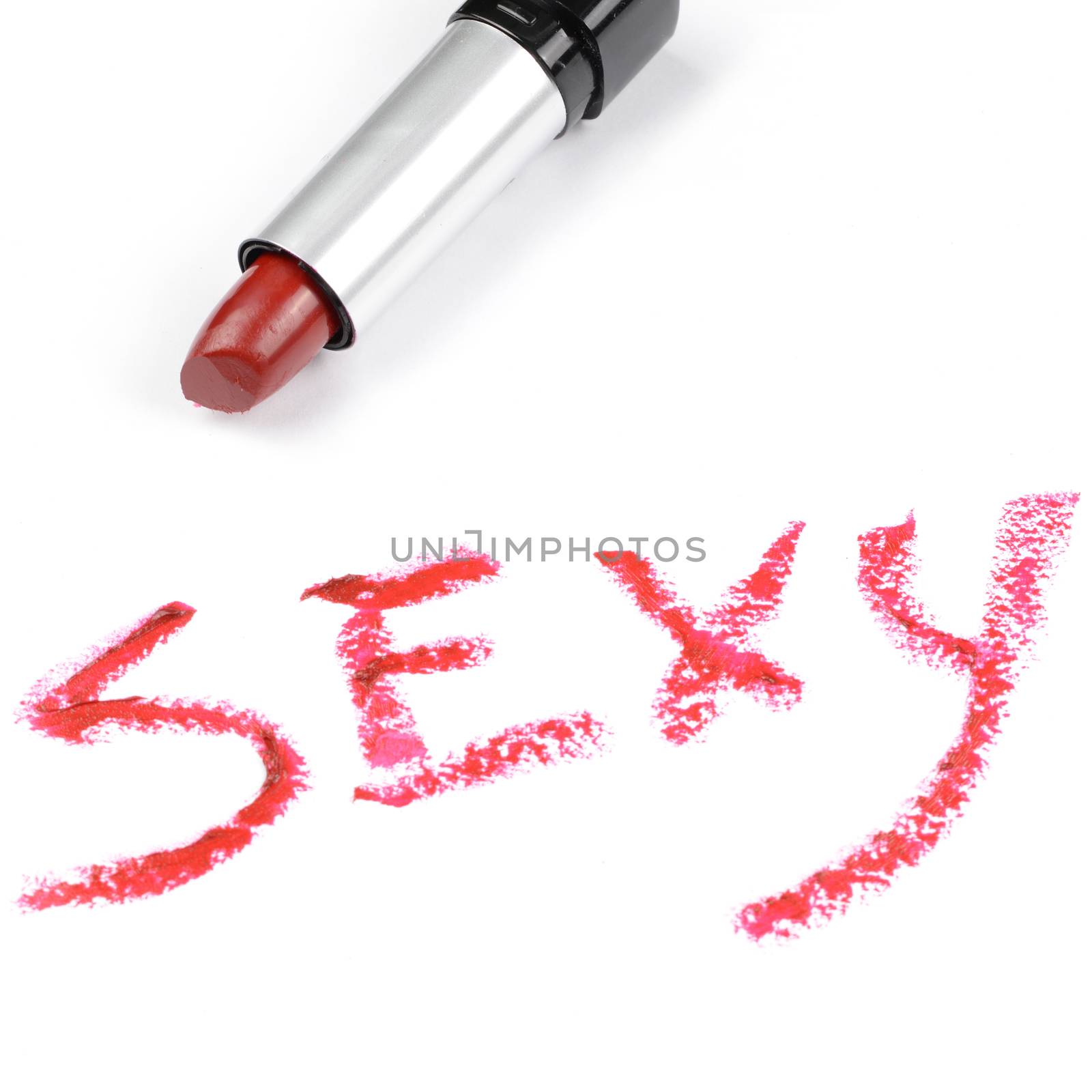 A seducing red lipstick written word sexy.