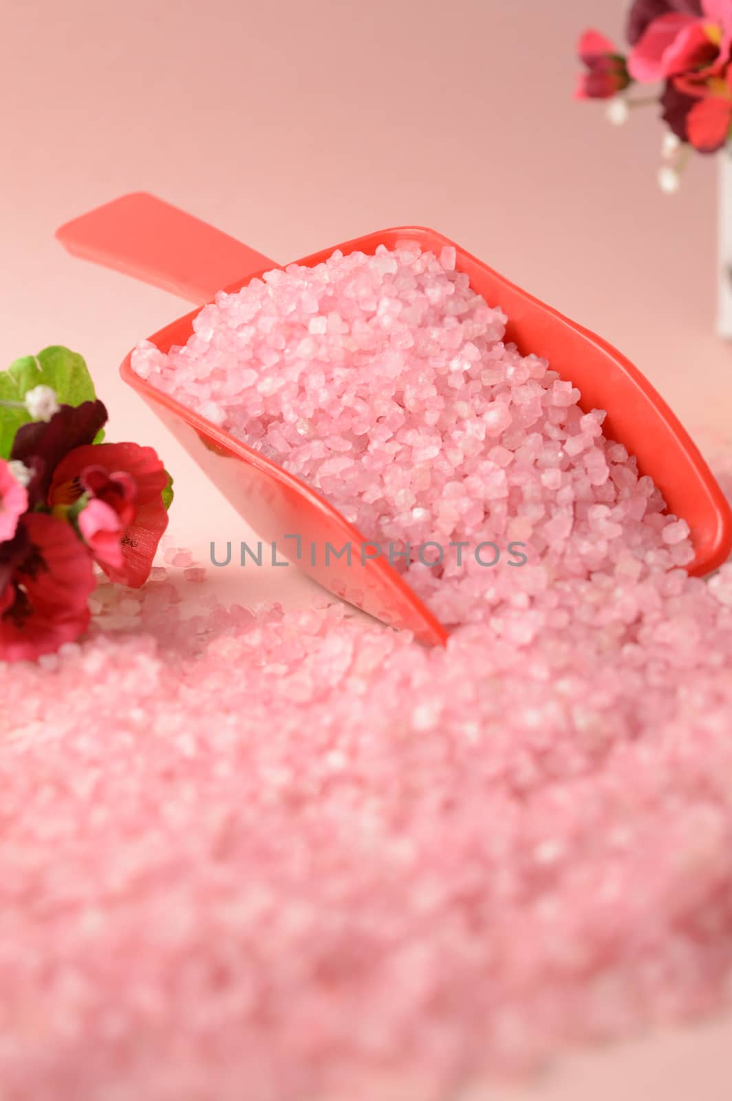 A scoop of cleansing pink bath salts to add to your hygiene routine.