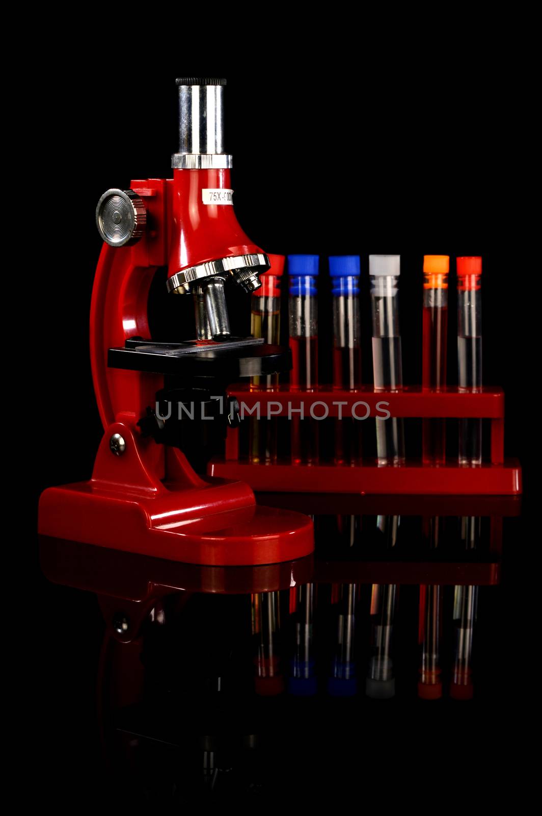 A view of the equipment inside the microbiology research lab showcasing a microscope and test tubes.