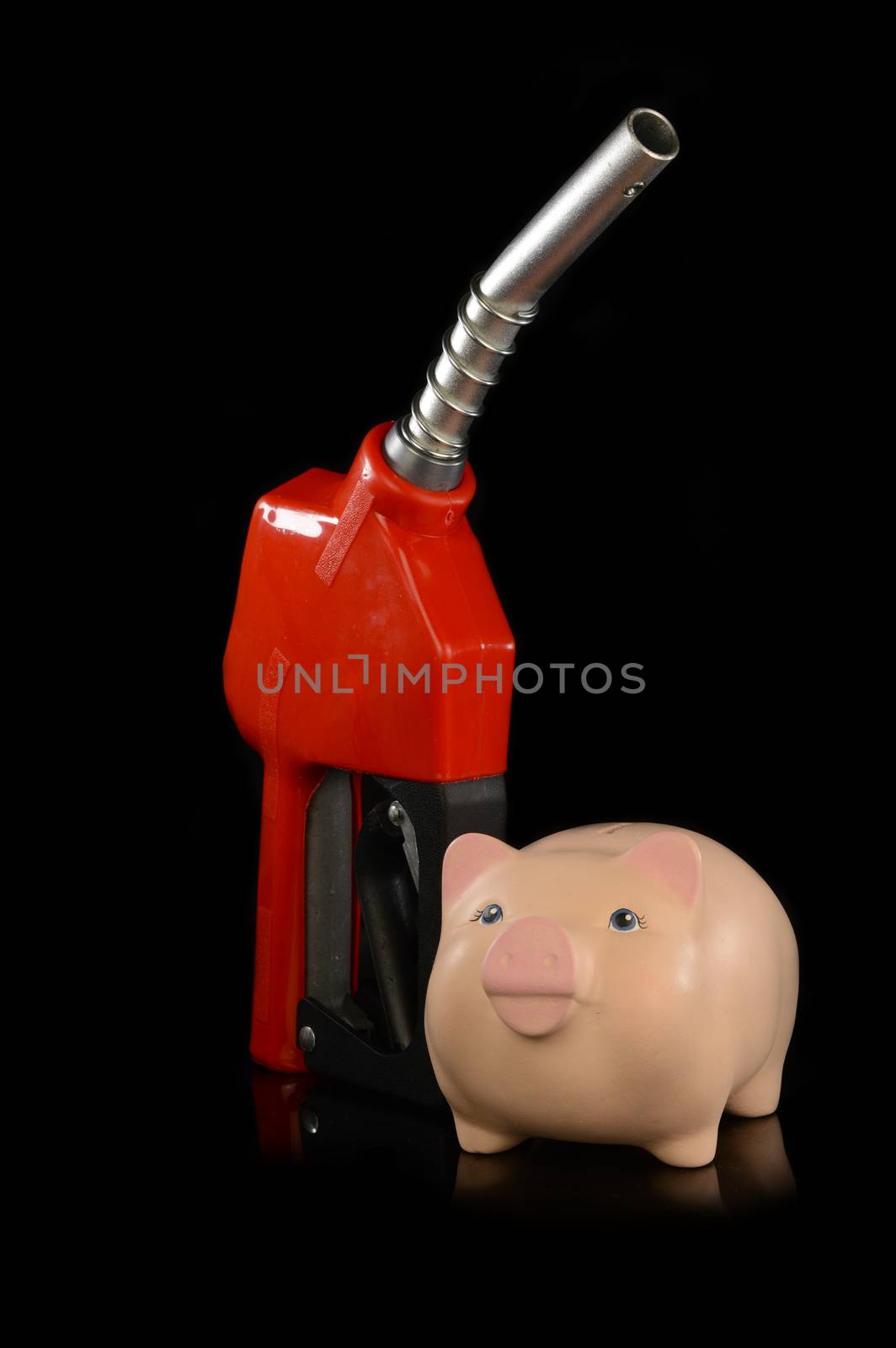 A red gas pump nozzle with a pig bank for various concepts.