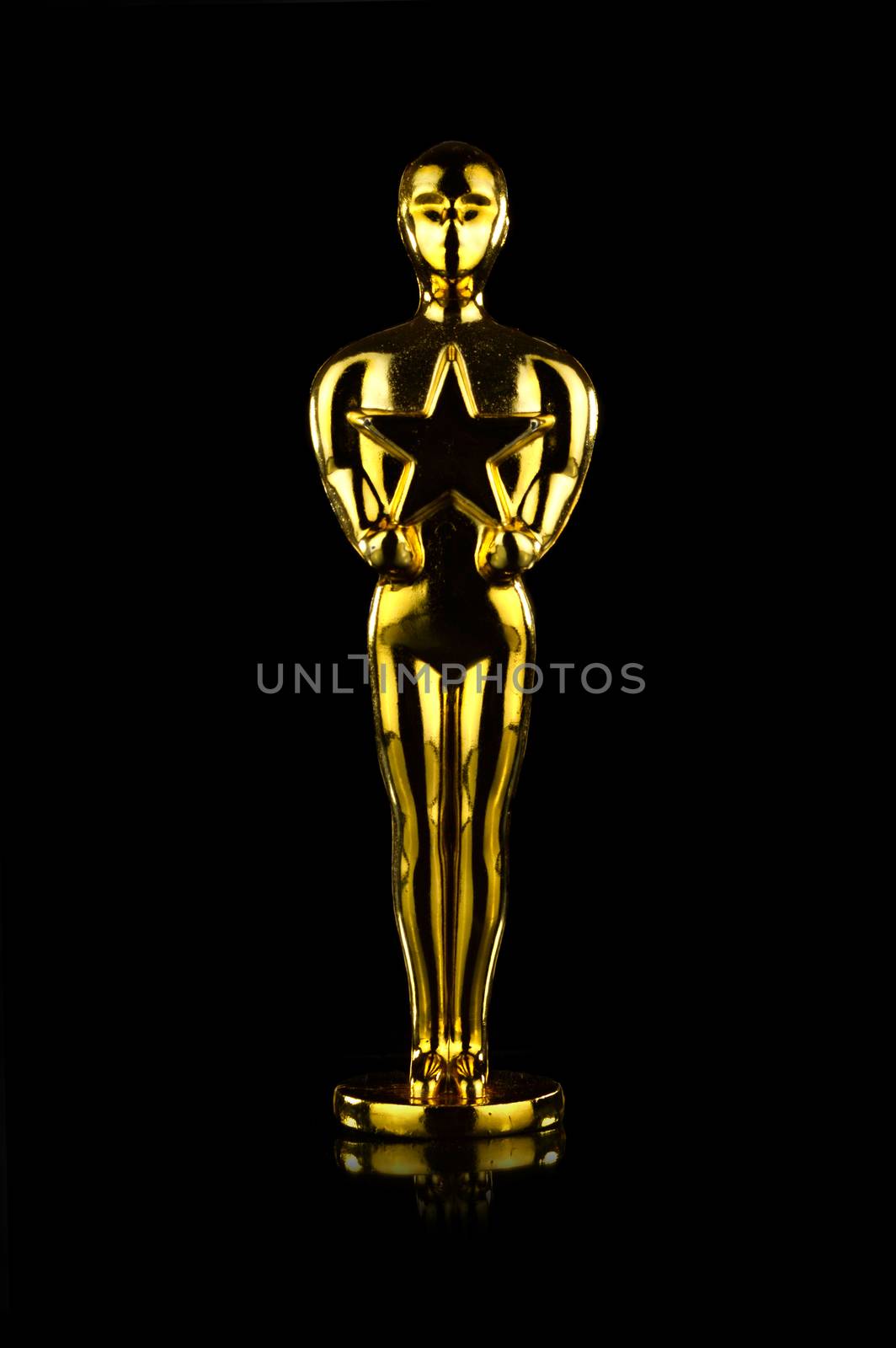 An isolated over black background image of a gold star awarded trophy.