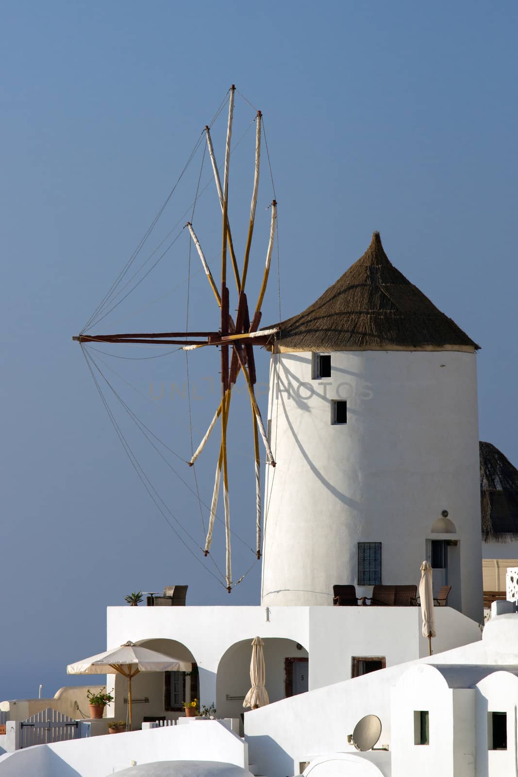 One of the typical windmills in Oia on Santorini island