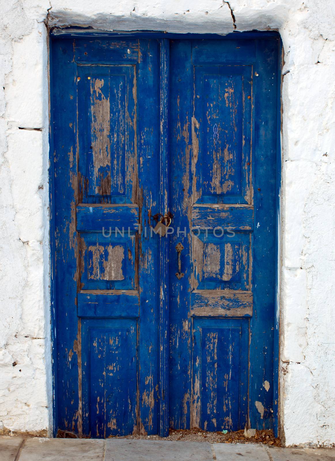 A blue door seen on a Cyclade island