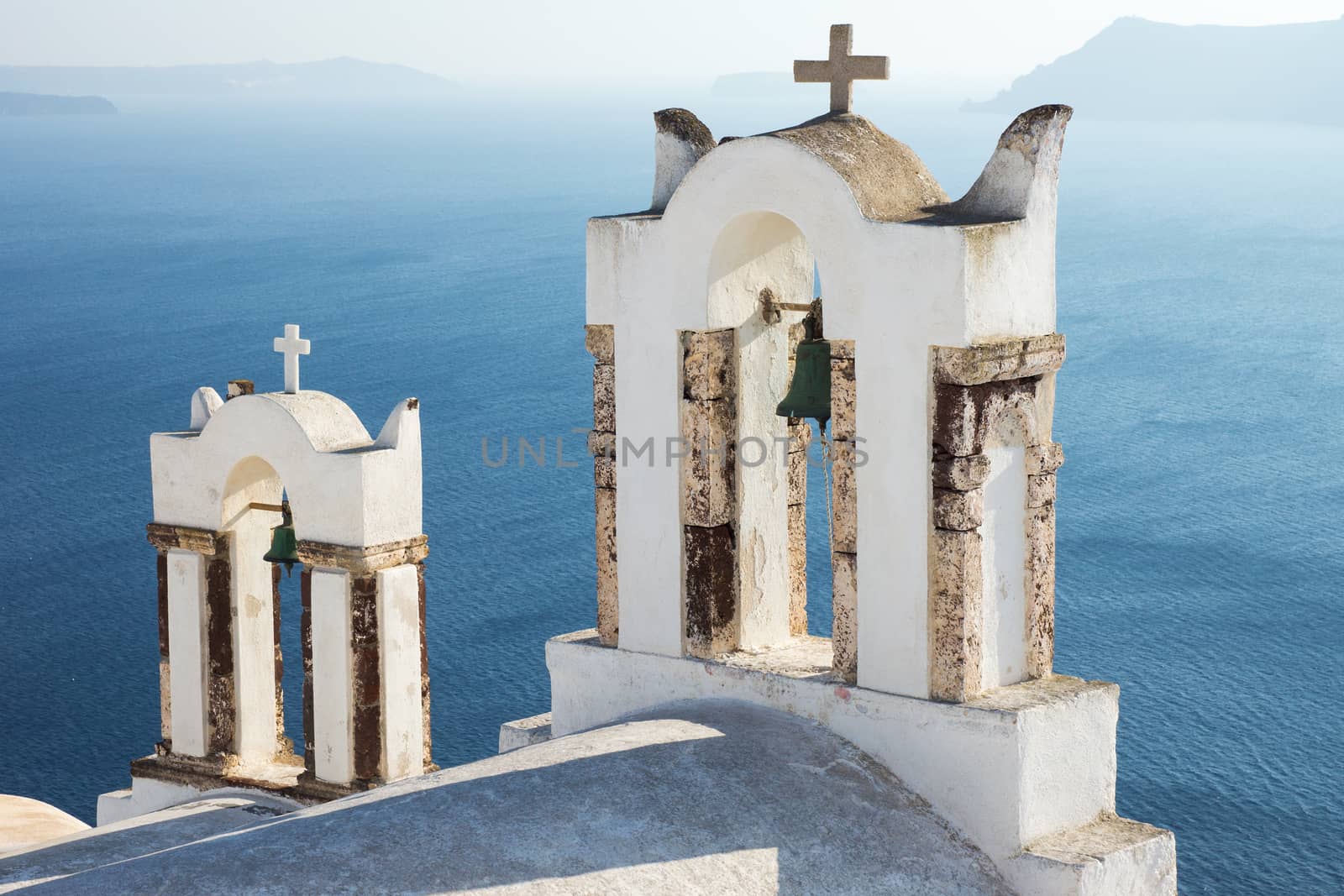 Two small belltowers seen in Oia, Santorini
