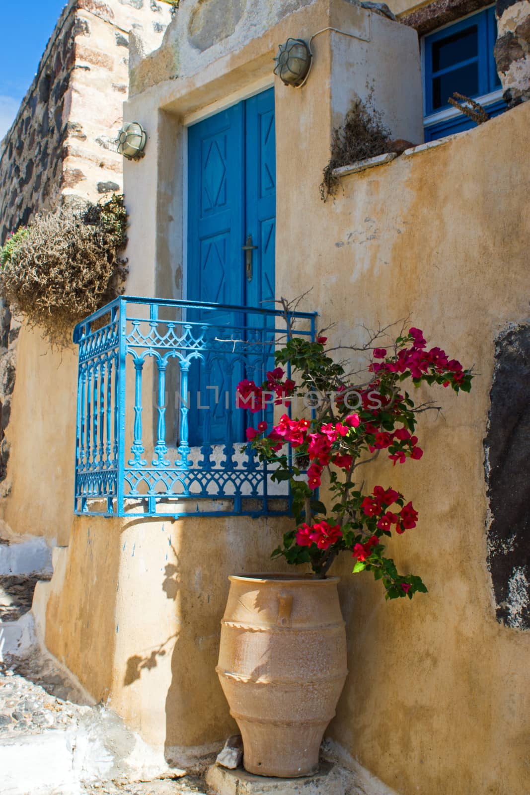 Blue door with flowers in Pyrgos, Santorini island