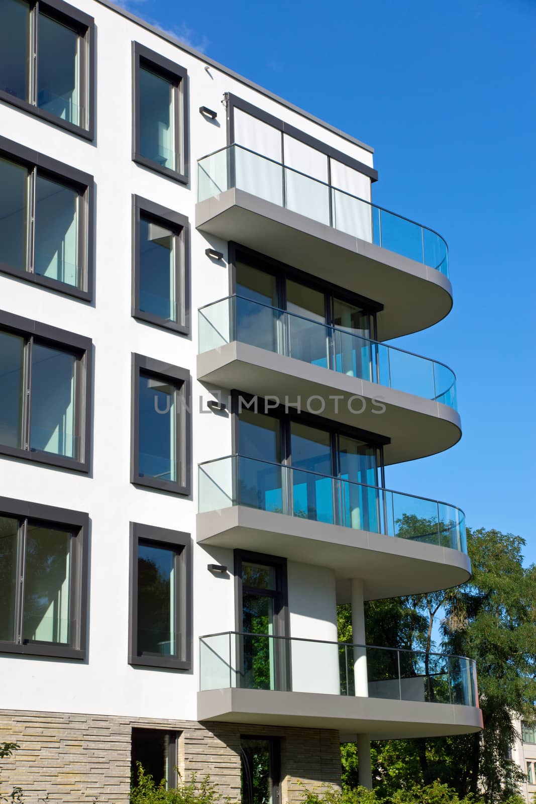 A modern apartment house with round balconies