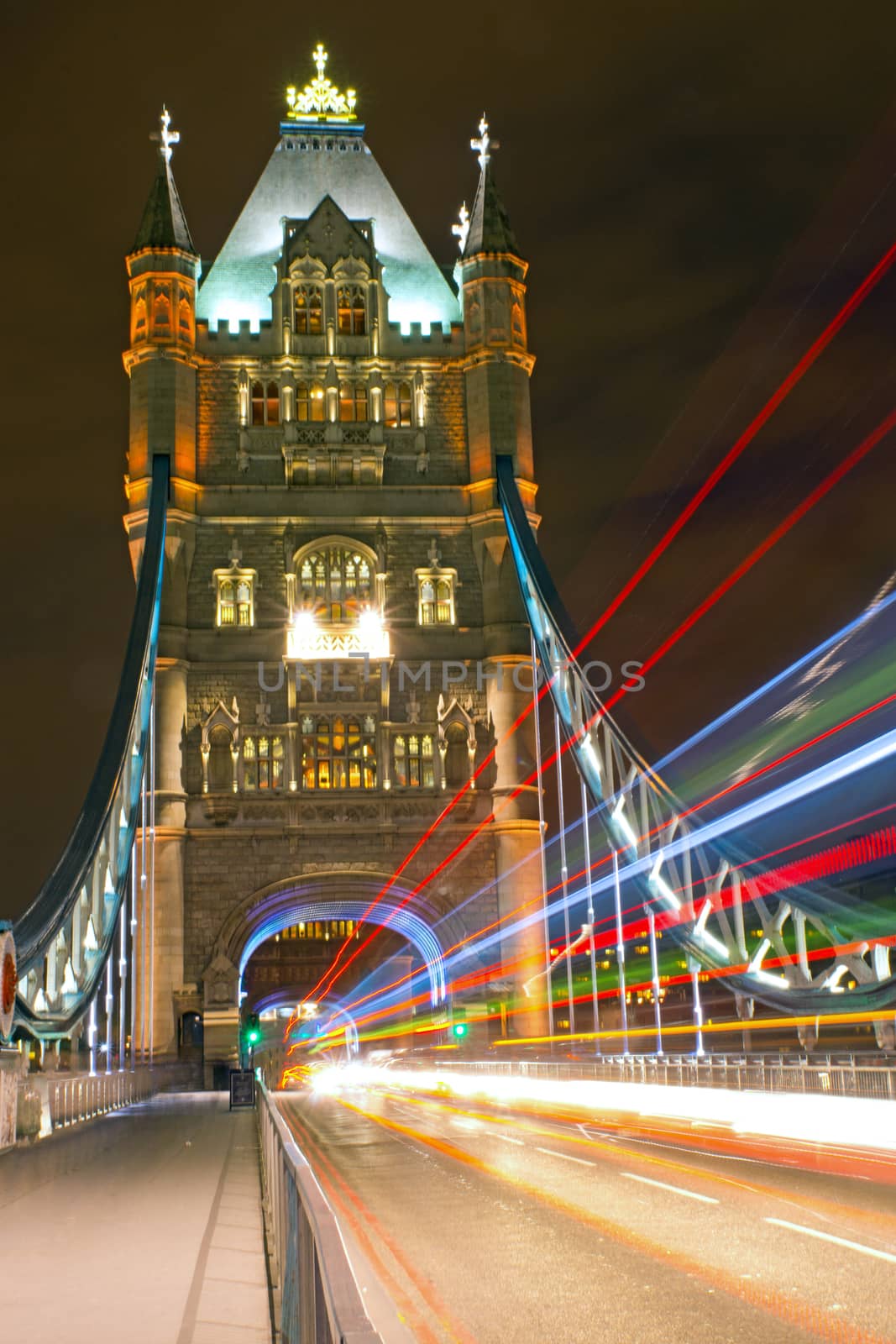 The illuminated Tower Bridge in London with traffic lights