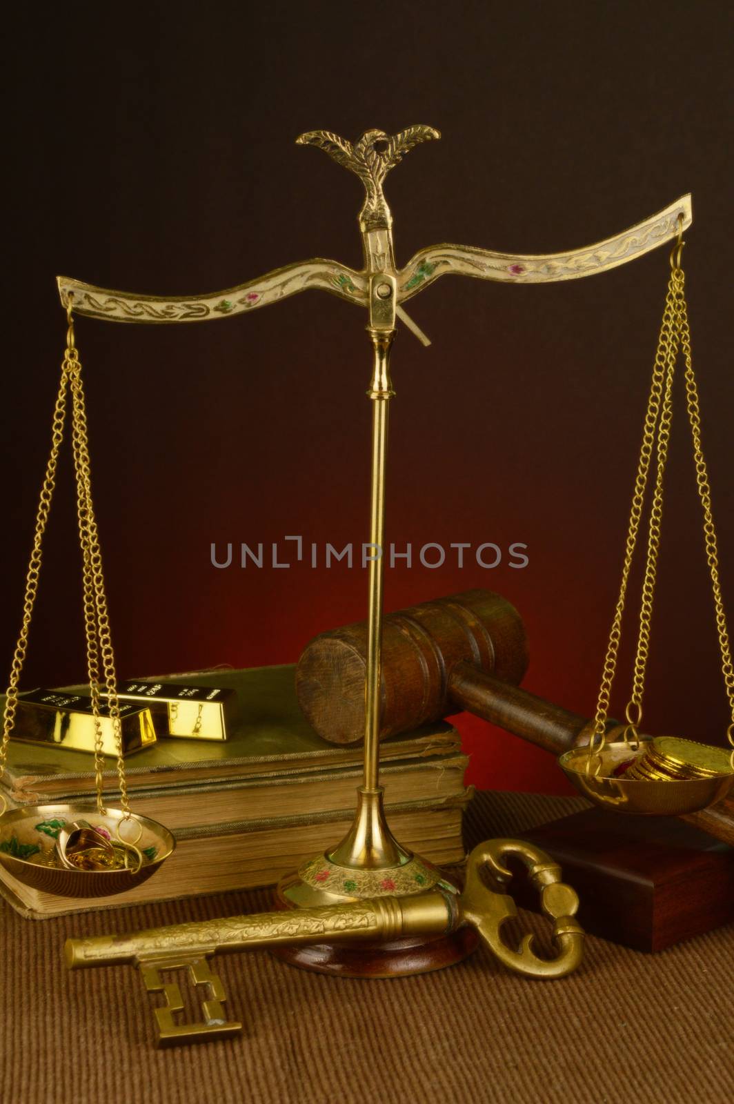 A vintage style image of an antique brass scale measuring gold as the point of focus.