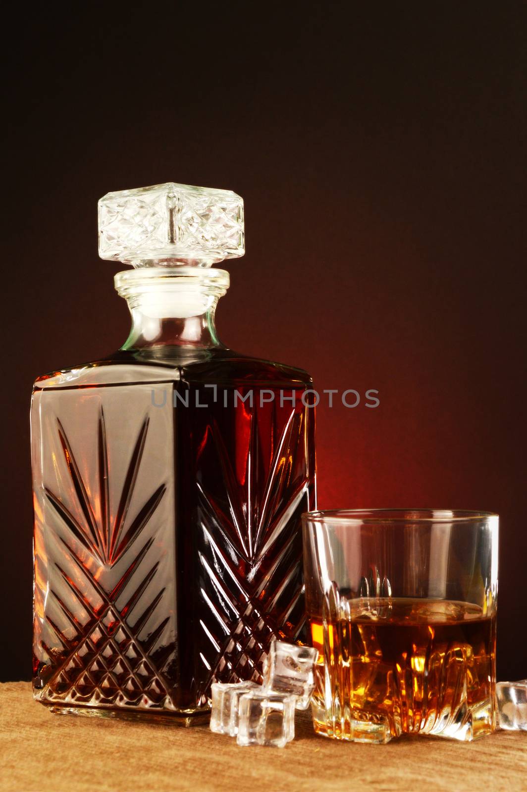 An elegant antique look and feel to this focused theme of whisky on the rocks.
