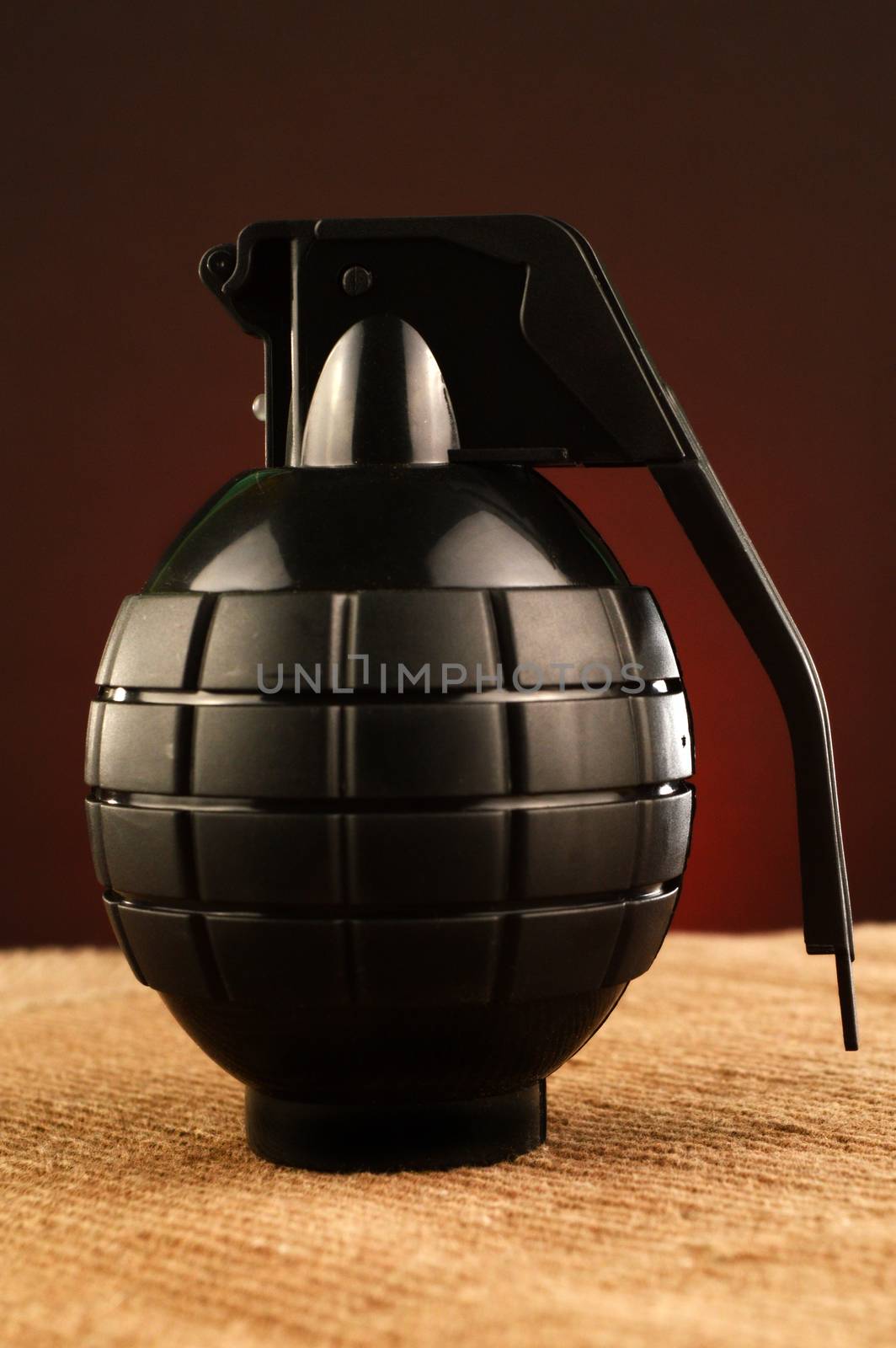 A new fully loaded hand grenade ready for military combat.